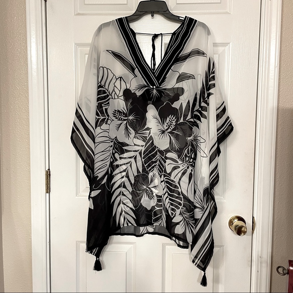 NWOT Beautiful sheer swim cover up.